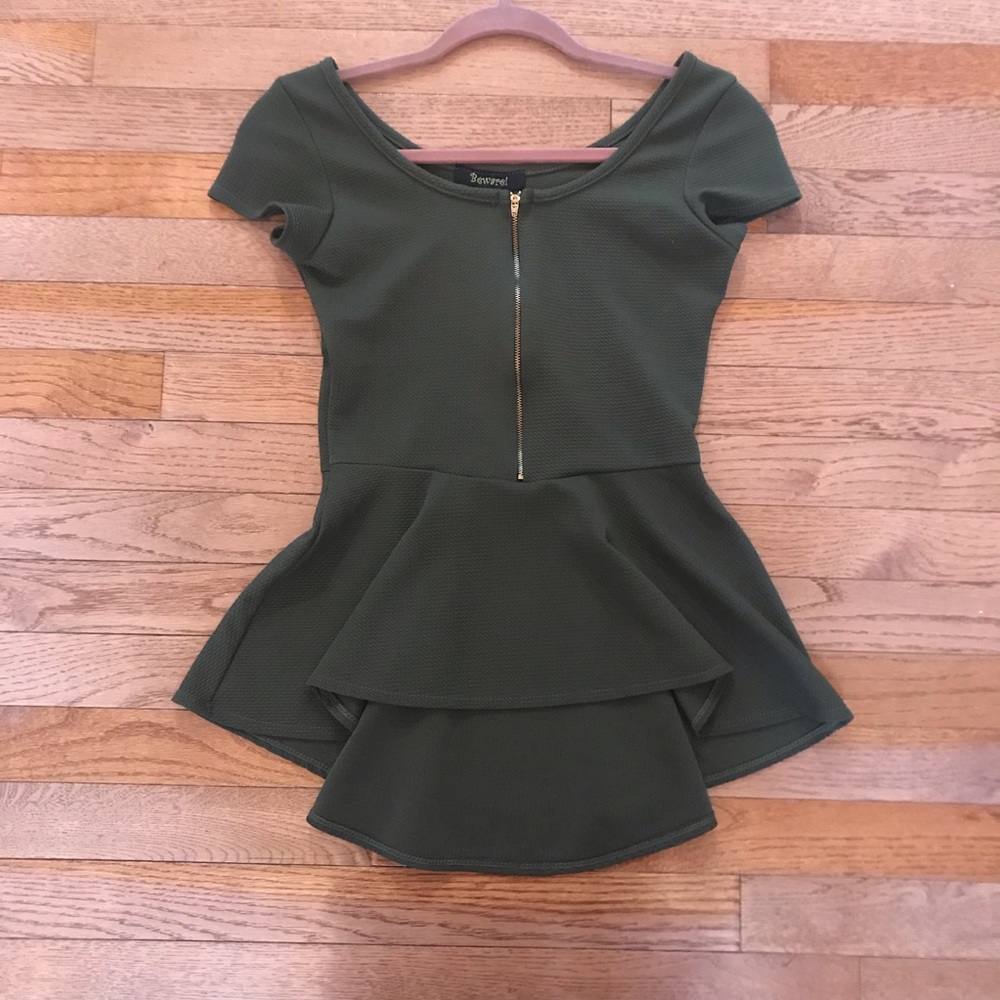 Green zip-up peplum short sleeve top.